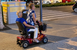 two ladies on single scooter