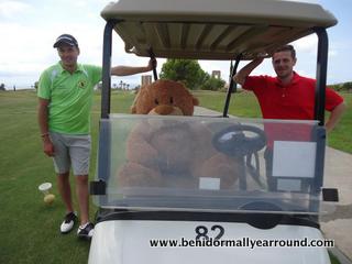 brian bear in golf buggy