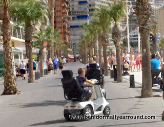 young boy on scooter