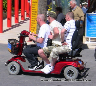 3 riding a scooter